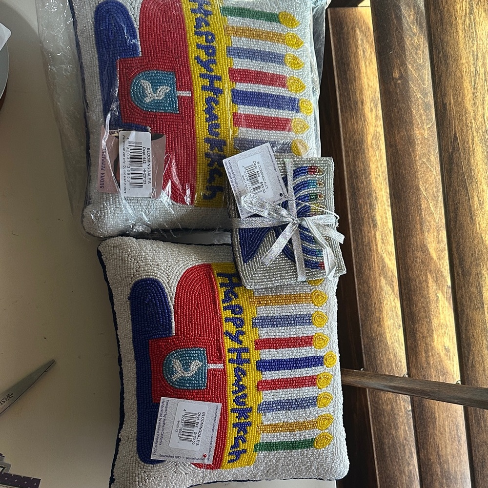 Sudha Pennathur Multicolor Happy Hanukkah Accent Pillows and coasters.